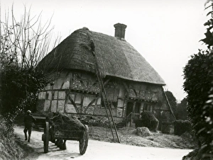 Bignor General Shop with thatcher and horse and cart, February 1938 Bignor General Shop with thatcher and horse and cart, February 1938