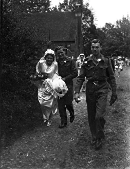 Bridal party walking down church path, Groom in army uniform, 1940s Bridal party walking down church path, Groom in army uniform, 1940s