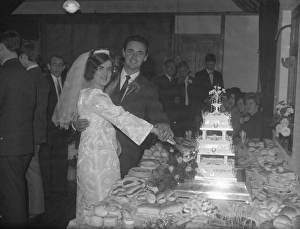 Bride and Groom cutting the wedding cake