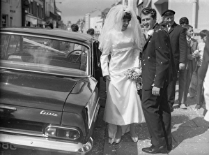 Bride and Groom on Wedding Day standing next to Wedding car Bride and Groom on Wedding Day standing next to Wedding car