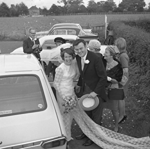 Wedding Prints: The bridge and groom with guests, 1960s