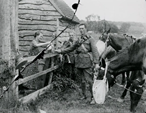 Two Cavalry soldiers accepting a drink at a cottage, August 1936 Two Cavalry soldiers accepting a drink at a cottage, August 1936