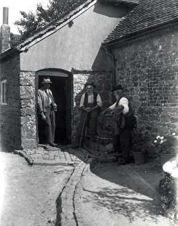 Three country gentlemen chatting in a farmyard at Upperton, Sussex. August 1936 Three country gentlemen chatting in a farmyard at Upperton, Sussex. August 1936