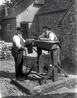 Rural Prints: Two country gentlemen chatting by a well at Upperton, Sussex. August 1936