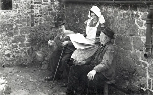 Farm Prints: Two country gentlemen and young lady discussing a newspaper in 1930s