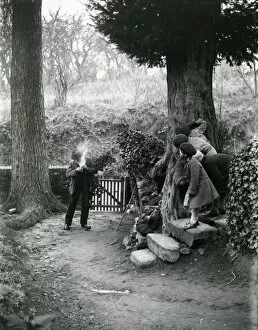 Images Dated 25th July 2013: Country man lighting his pipe at Upperton, December 1935