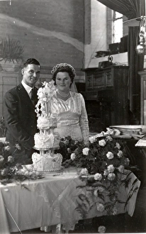 Cutting the cake at a wedding at Parham. Sussex