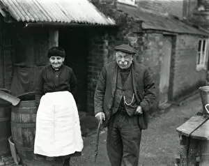 Images Dated 24th July 2013: Elderly couple outside their country cottage in Sussex