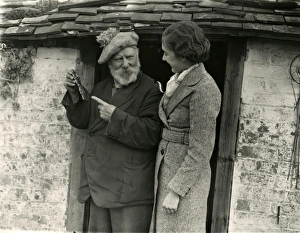 Beret Prints: Elderly man and younger lady in conversation, March 1938
