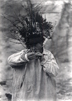 Elderly shepherd lighting his pipe, January 1925 Elderly shepherd lighting his pipe, January 1925