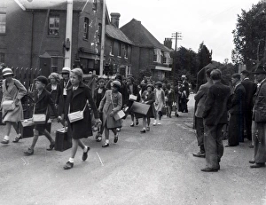 Evacuees walking through town, September 1939