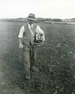 Images Dated 24th July 2013: Farm worker fiddling trifolium [clover] seed, September 1933