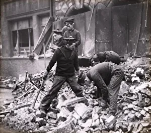 Uniform Prints: Free French sailors helping with clear up after air raid, Portsmouth, 1941