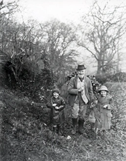Beard Prints: Gentleman and two children bringing home the holly, Petworth, West Sussex