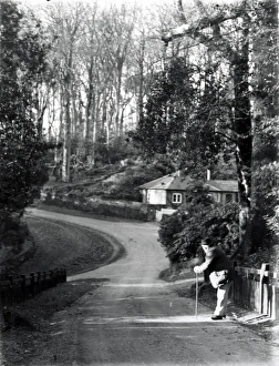 Road Prints: Gentleman leaning on stick in country lane, January 1935
