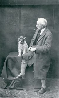 Images Dated 30th May 2008: Gentleman smoking a pipe and dog