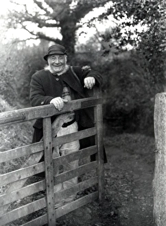 Happy Prints: Gentleman standing behind farm gate at Upperton, Sussex