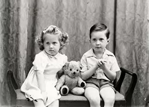 Images Dated 28th January 2013: Girl and boy posing with a teddy bear