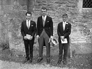 Chichester Photographic Collection: Groomsmen at wedding stood outside church