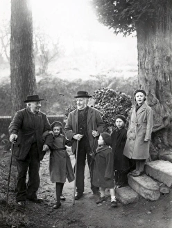 Group of people chatting on a footpath in woods at Upperton, Sussex, December 1935 Group of people chatting on a footpath in woods at Upperton, Sussex, December 1935