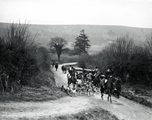 Hunting scene with dogs, horses and cars in Sussex