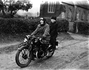Two ladies riding a motorbike