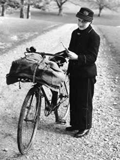 Lady postman with bike and letter bag, 22 March 1945