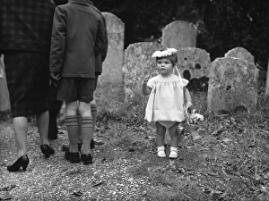 Little bridesmaid in churchyard Little bridesmaid in churchyard