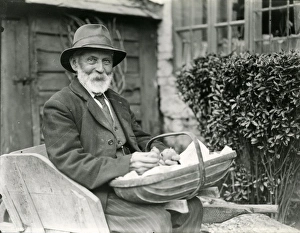 Man sitting outside house