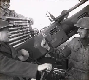 Military Prints: Two men on a gun at Canadian anti-aircraft battery, Felpham, December 1942
