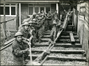 Men of The Royal Artillery moving barrel of gun, Bognor Regis 1940 Men of The Royal Artillery moving barrel of gun, Bognor Regis 1940