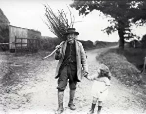 Images Dated 15th October 2012: Old Gentleman and Young Girl Wood Gathering