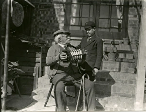 Moustache Prints: Old man with his accordian, April 1938
