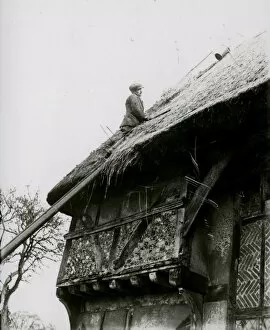 Images Dated 22nd August 2014: Roof thatching on Bignor General Shop, February 1938