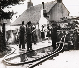 Soldier pointing pistol at fire service personnel Soldier pointing pistol at fire service personnel