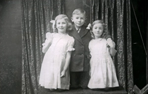 Suit Prints: Studio portrait of two girls and a boy, December 1935