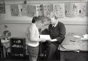 Chichester Photographic Collection: Teacher and two children, Lancastrian Infants School, Chichester, May 1956