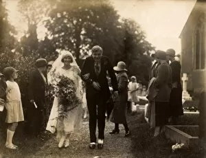 Images Dated 11th March 2015: Wedding Couple being showered with confetti, 1925