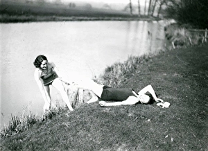 Two young ladies playing on a river bank at Stopham, March 1938 Two young ladies playing on a river bank at Stopham, March 1938