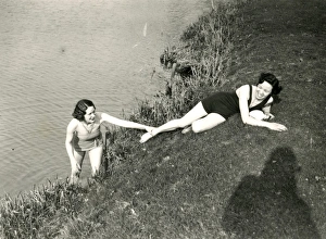 Water Prints: Young ladies posing on a river bank in Stopham, March 1938